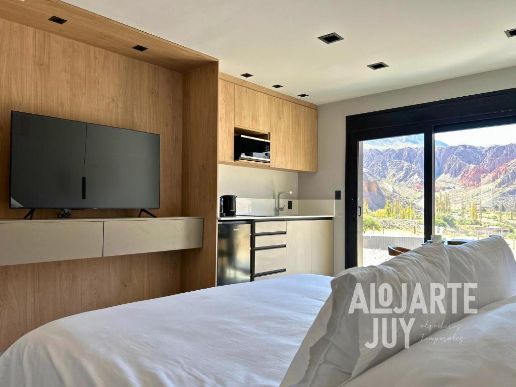 En eller flere senge i et værelse på Altos de la Quebrada II