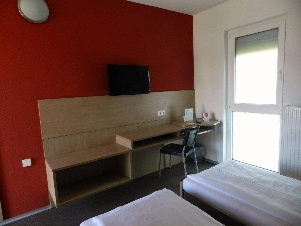 Postel nebo postele na pokoji v ubytování Motel Angern