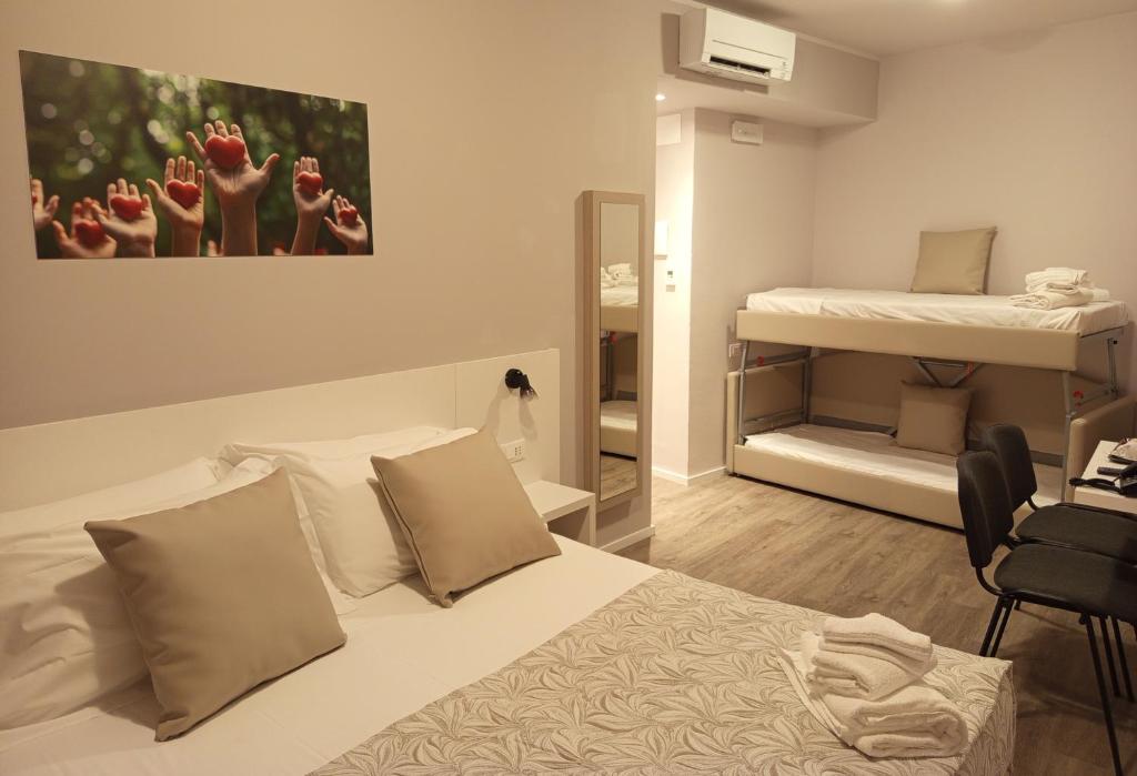 Postel nebo postele na pokoji v ubytování Hotel Acquario