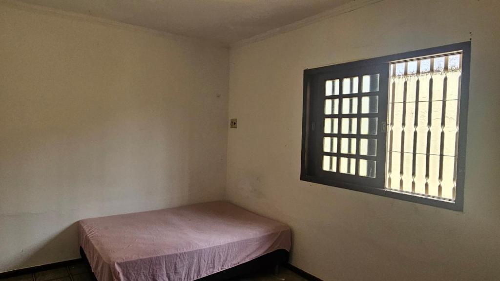 Postel nebo postele na pokoji v ubytování Temporada suítes e quartos praias e centro