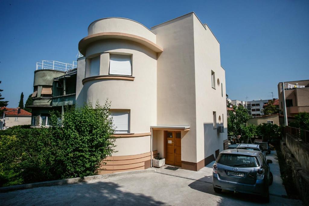 a house with a car parked in front of it at Villa Lole in Split