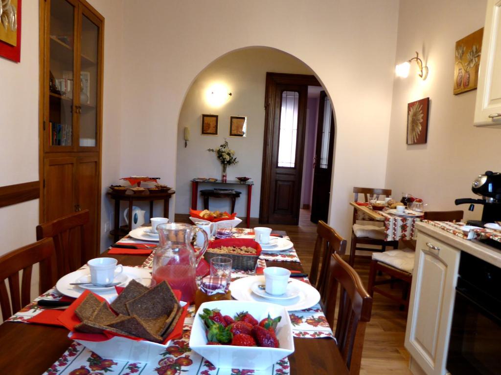 a dining room with a table with fruit on it at Da Nonna Vera in Turin