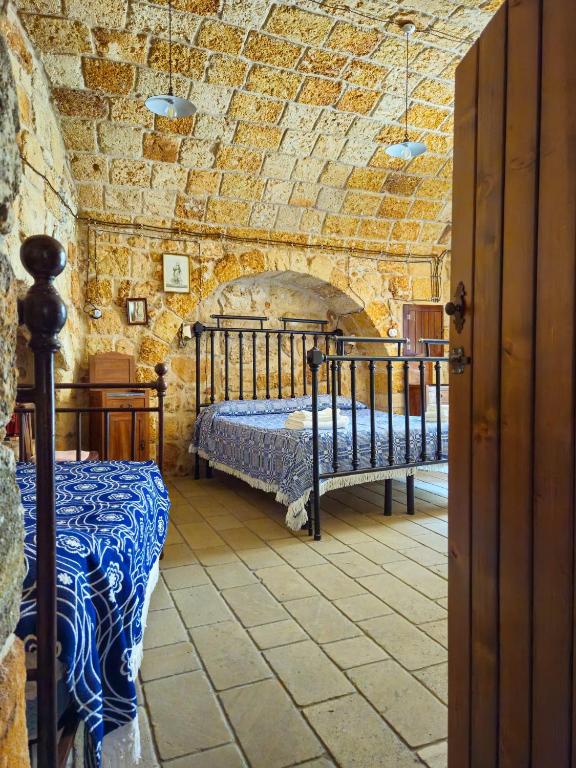 Postel nebo postele na pokoji v ubytování B&B Pergulea