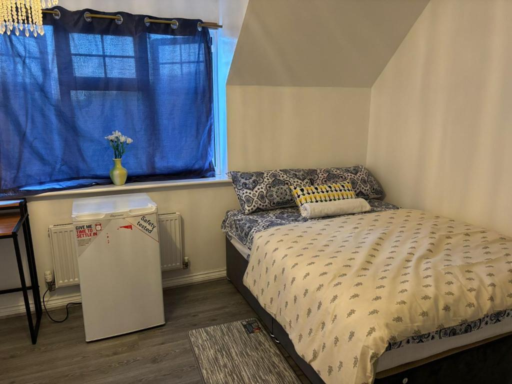 Ένα ή περισσότερα κρεβάτια σε δωμάτιο στο EC Prime Home - Wigan, UK