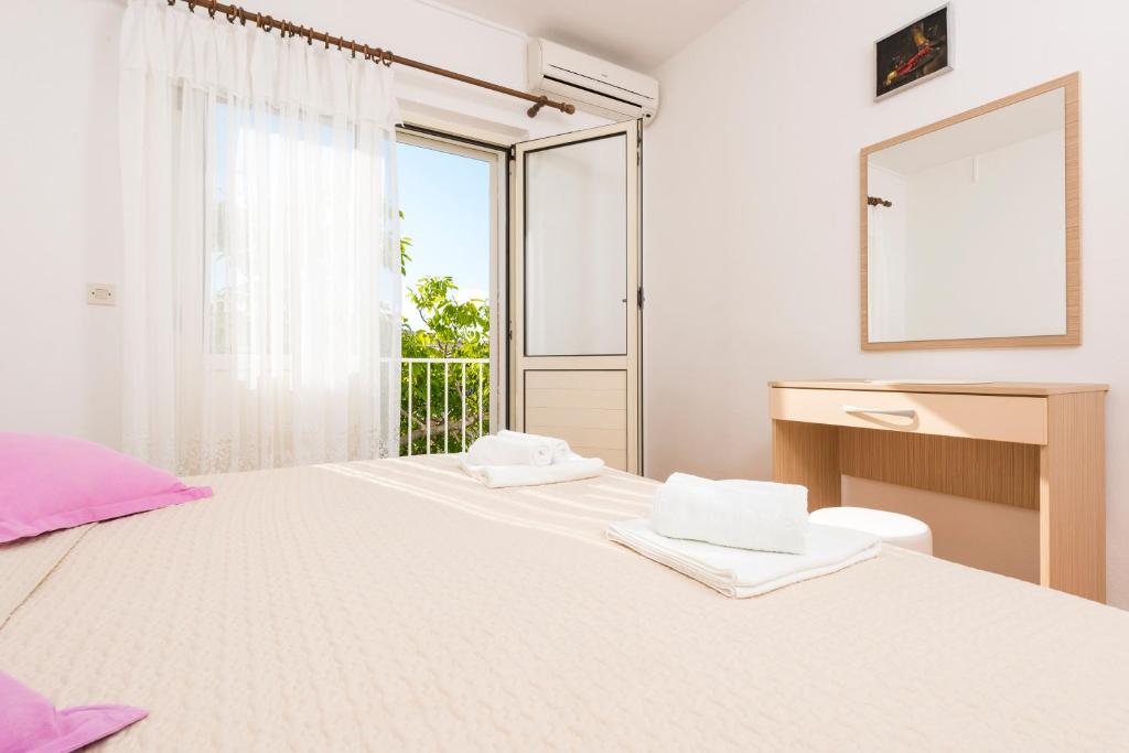Posteľ alebo postele v izbe v ubytovaní Apartments Nikola Stipišić