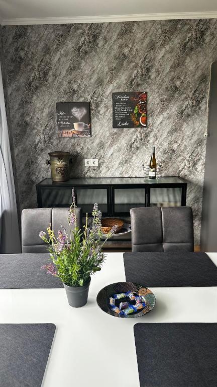 a living room with a couch and a table at Ferienwohnung Heideberg 2 in Kaisersesch
