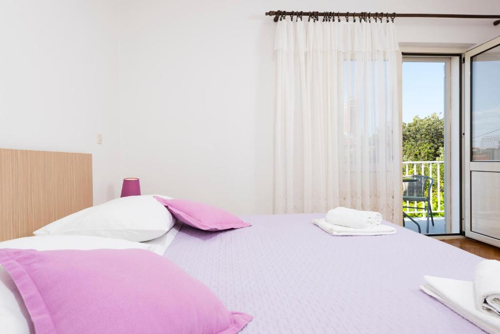 Posteľ alebo postele v izbe v ubytovaní Apartments Nikola Stipišić