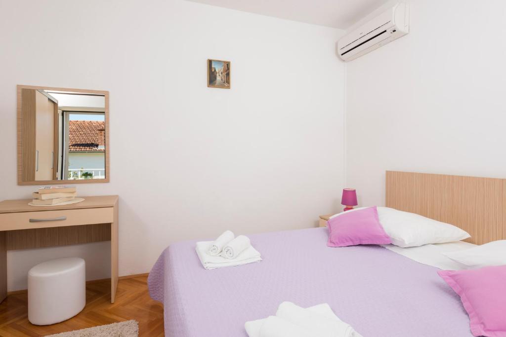 Posteľ alebo postele v izbe v ubytovaní Apartments Nikola Stipišić