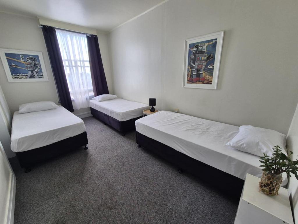 Postel nebo postele na pokoji v ubytování Royal Hotel Opotiki