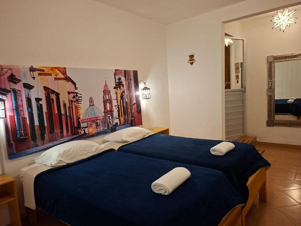 Postel nebo postele na pokoji v ubytování La Catrina Hostel