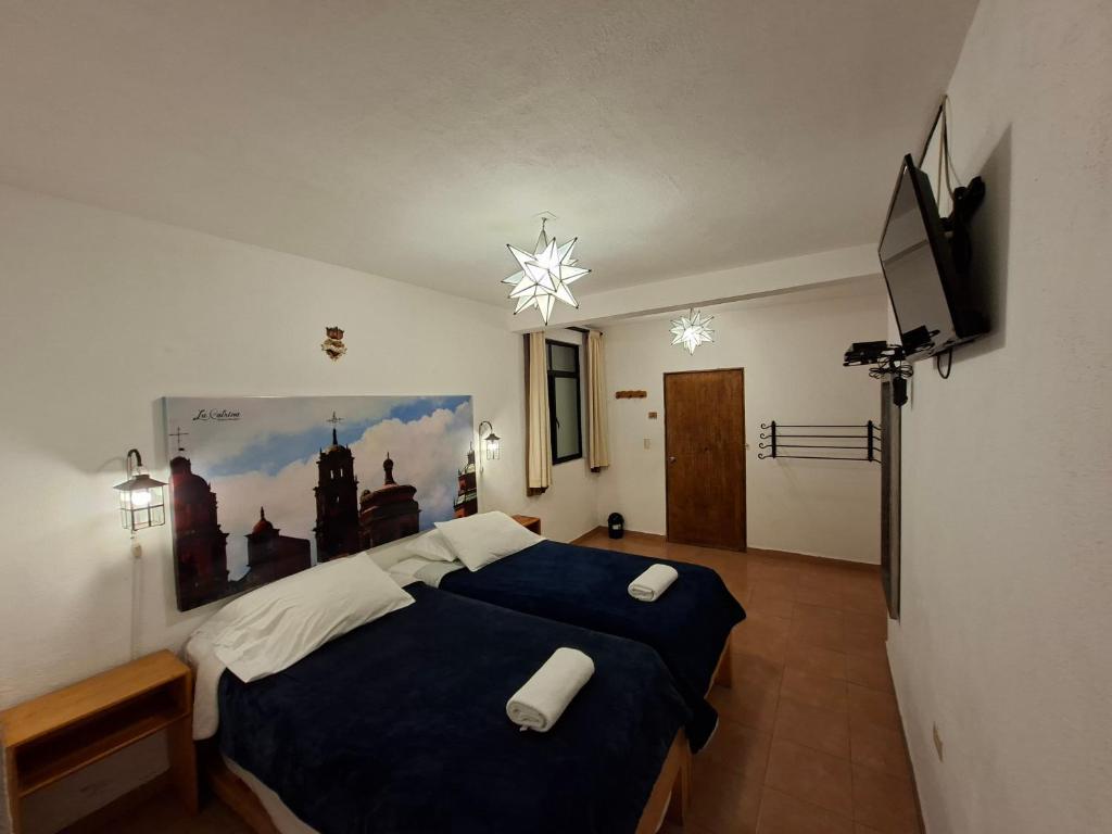 Postel nebo postele na pokoji v ubytování La Catrina Hostel