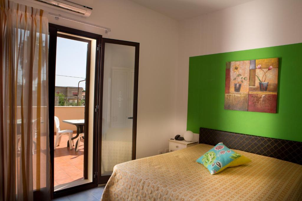 Postel nebo postele na pokoji v ubytování B&B Il Mandorlo