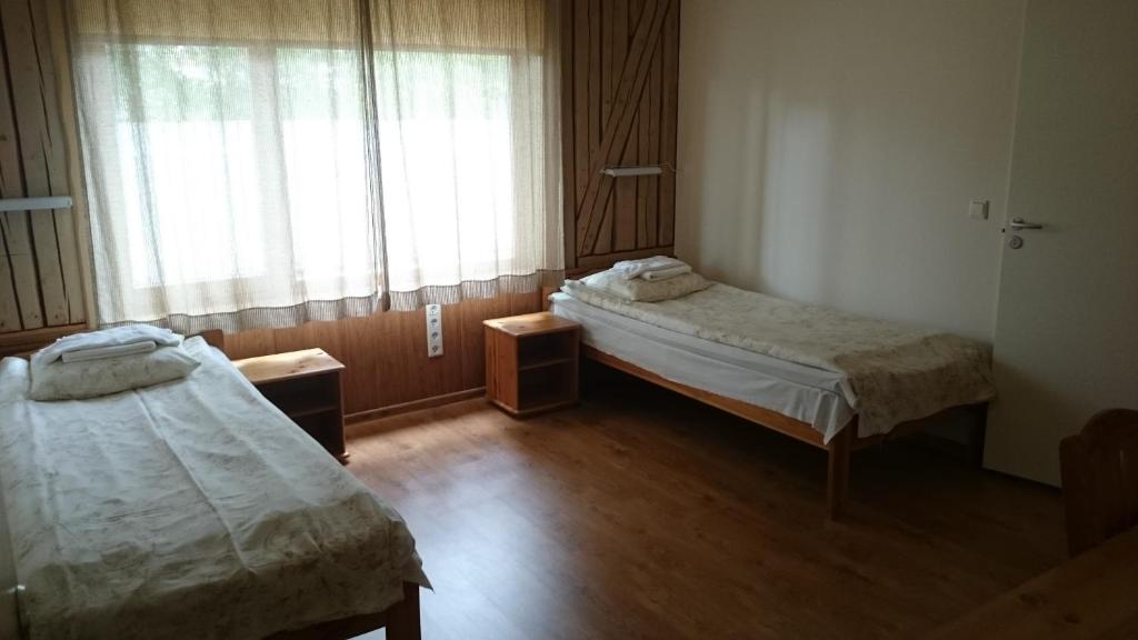 Postel nebo postele na pokoji v ubytování Aisa Accommodation