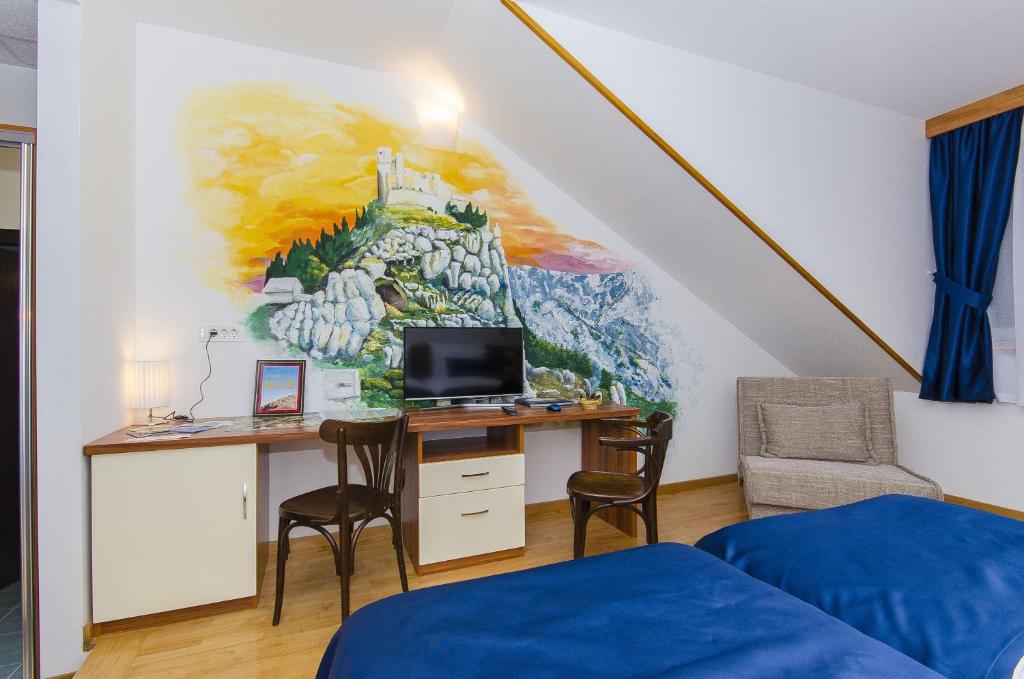 TV a/nebo společenská místnost v ubytování Palma Rooms B&B