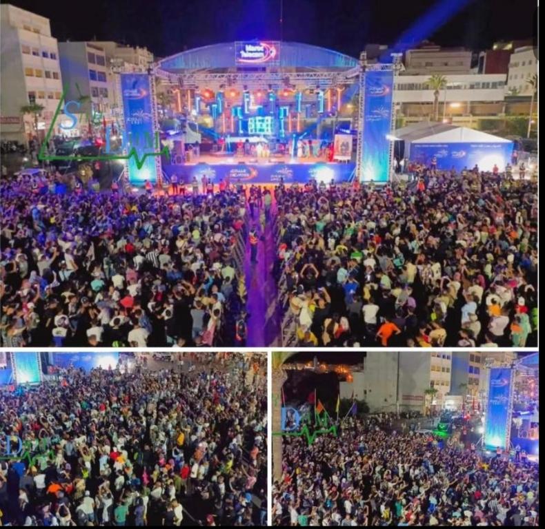 a large crowd of people at a concert at Appart Hoceima F4 Climatisé Central in Al Hoceïma
