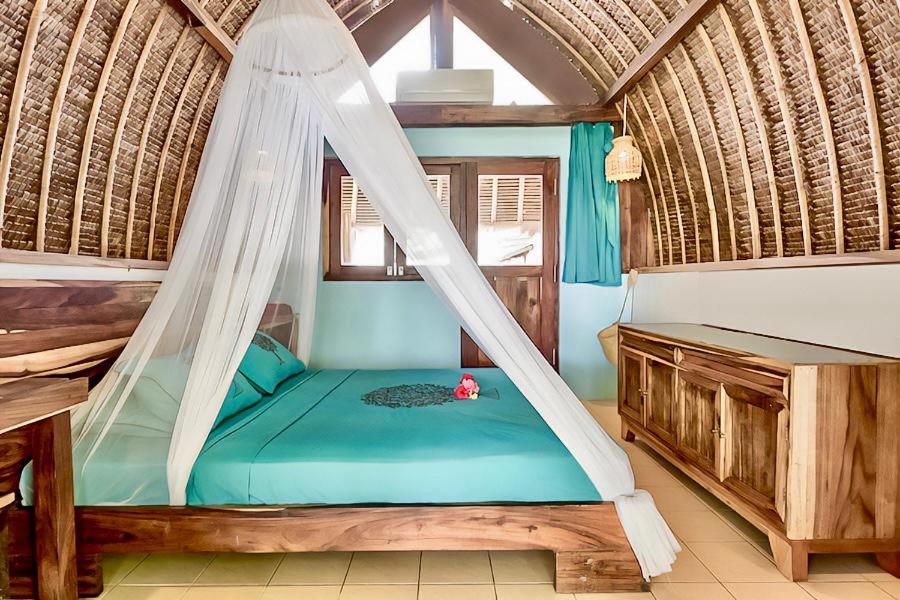 Voodi või voodid majutusasutuse Villa Monyet Java toas