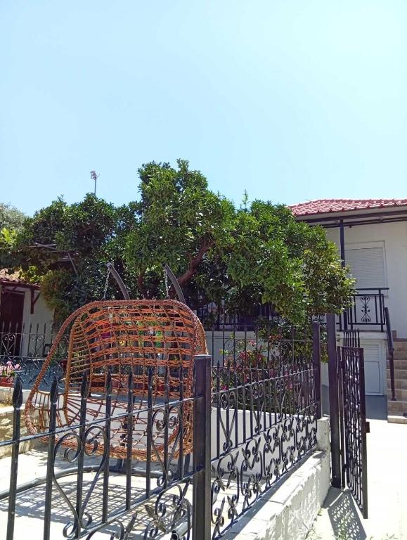 a wrought iron gate in front of a house at ANNAS COTTAGE in Skala Sotiros