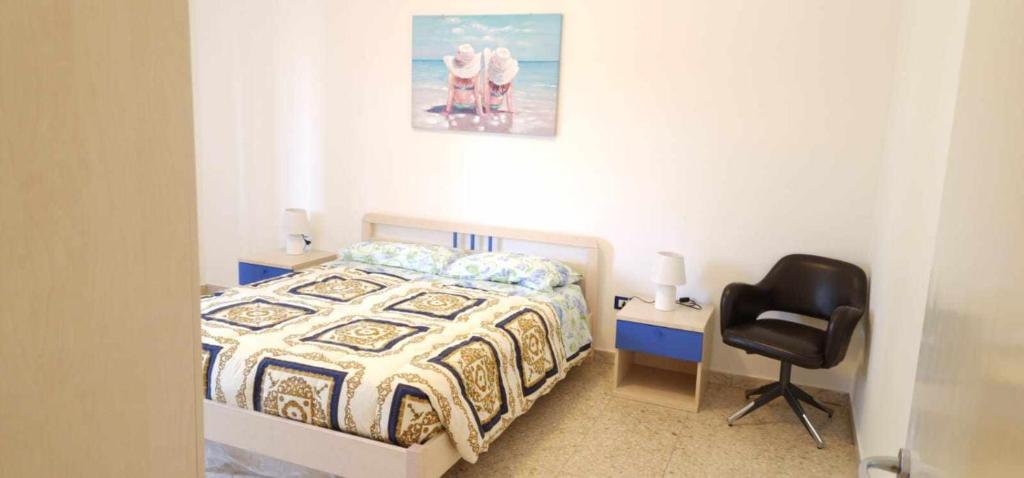 Postel nebo postele na pokoji v ubytování Lungomare - Casa Vacanze