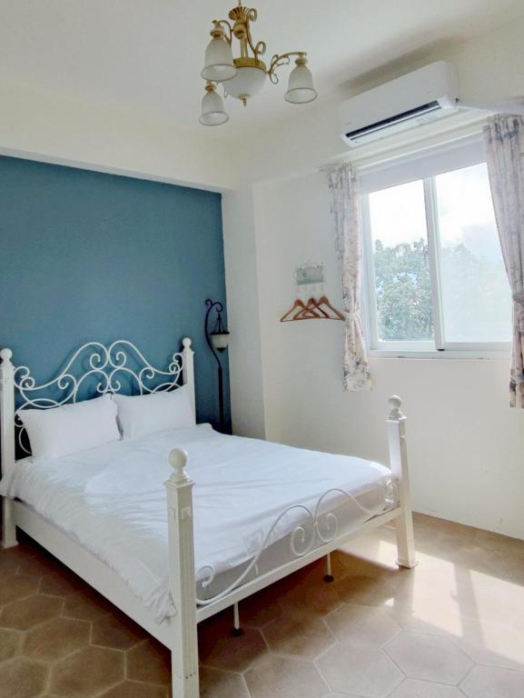 Ein Bett oder Betten in einem Zimmer der Unterkunft Ding Shian B&B