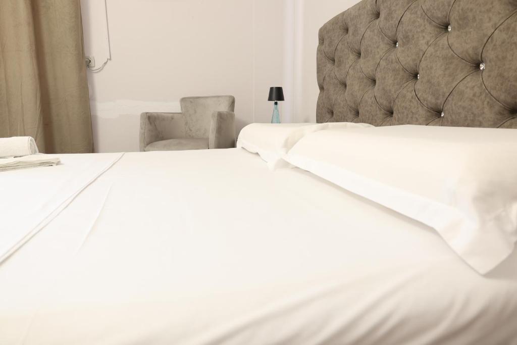 A bed or beds in a room at Central Hostel