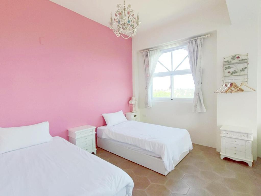 Ein Bett oder Betten in einem Zimmer der Unterkunft Ding Shian B&B