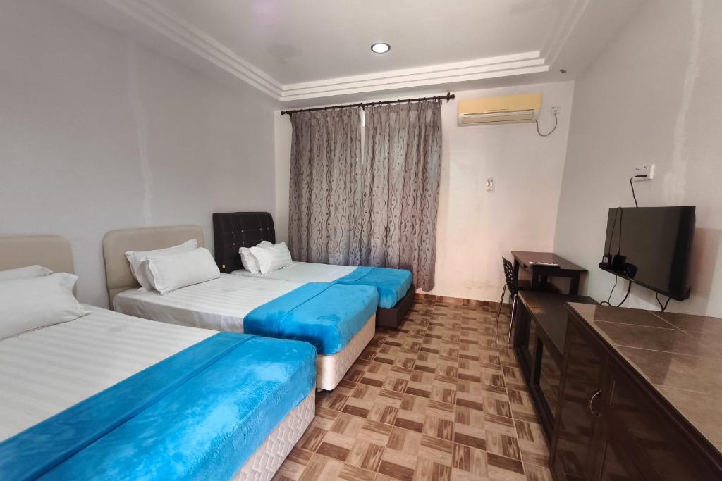 Darul Salam Inn - Habitación Triple De Lujo