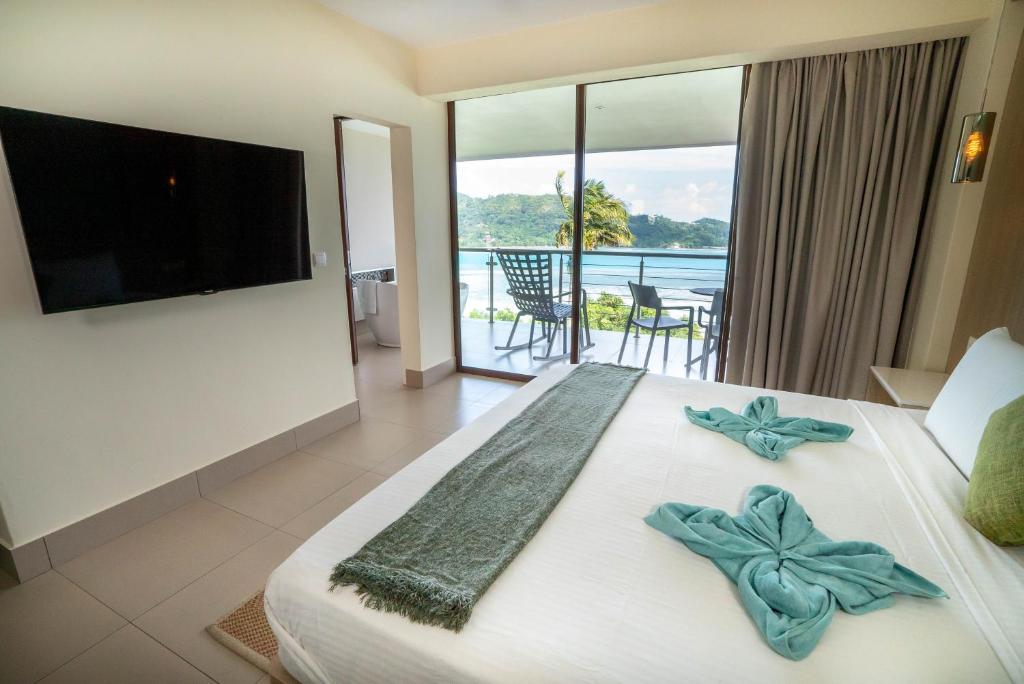 Postel nebo postele na pokoji v ubytování VILLA KIKI Seychelles