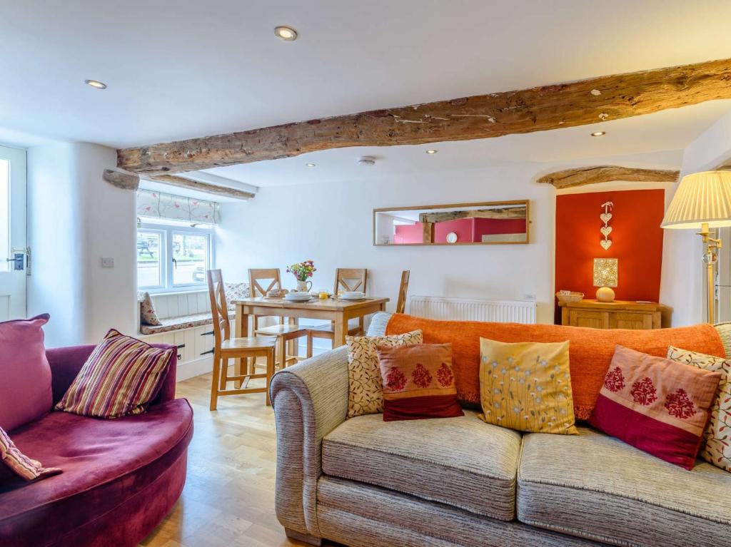a living room with a couch and a table at 2 Bed in Tideswell 81534 in Tideswell