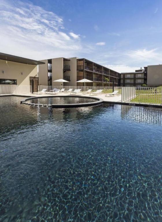 a large pool of water in front of a building at Studio Pont du Gard in Remoulins
