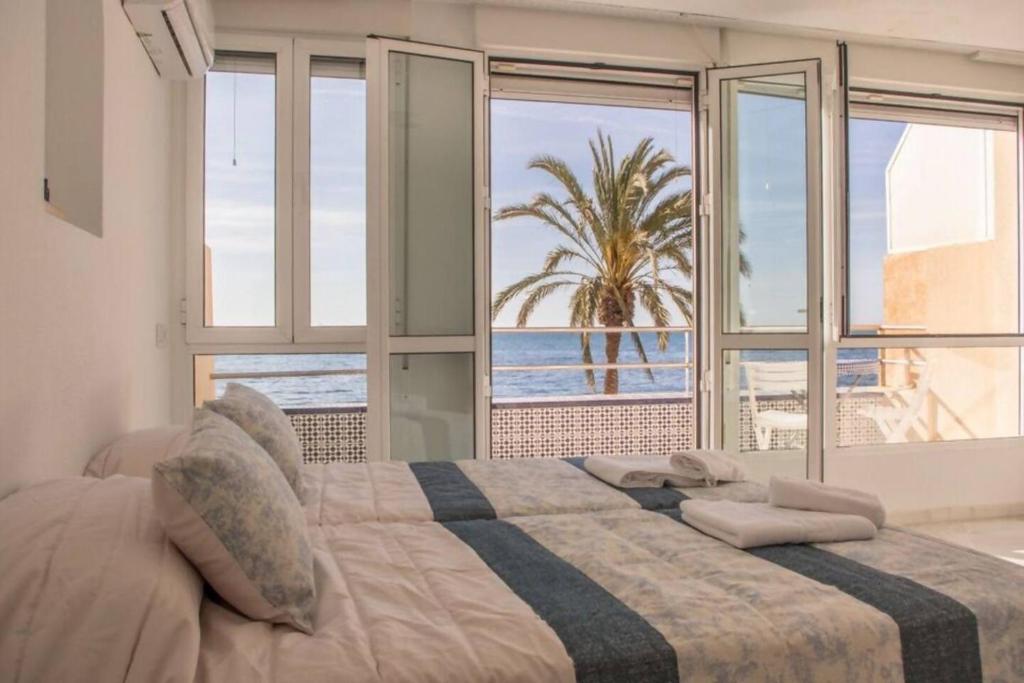 Posteľ alebo postele v izbe v ubytovaní Orilla playa aguadulce