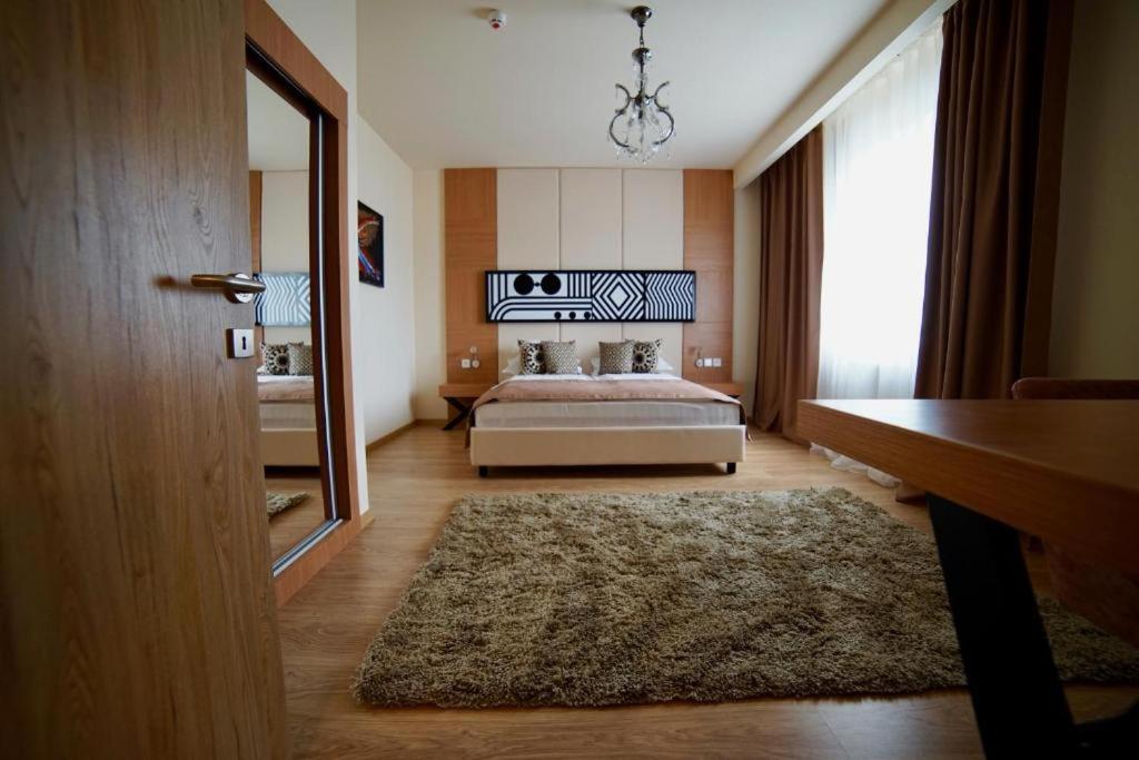 Postel nebo postele na pokoji v ubytování Astoria Hotel & SPA