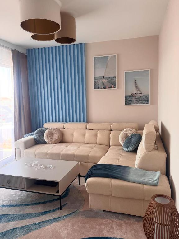 a living room with a couch and a table at Ferula apartment Vir in Vir