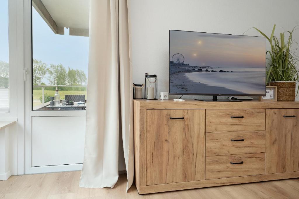 TV a/nebo společenská místnost v ubytování Hanseat Meer in Sicht