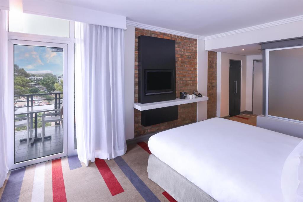 Een bed of bedden in een kamer bij Garden Court Victoria Junction