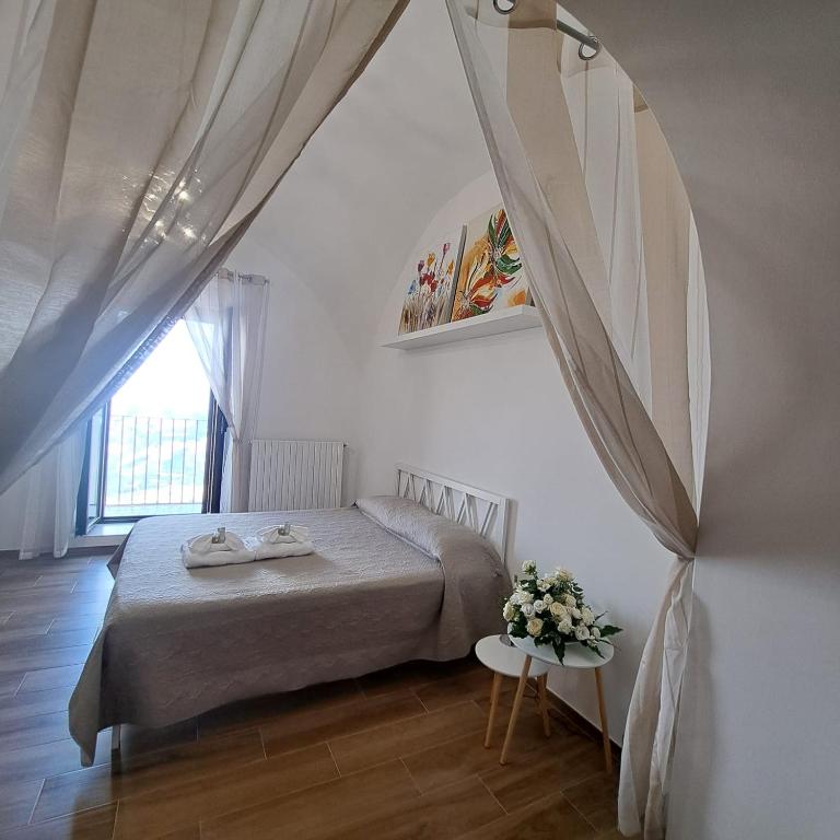 Postel nebo postele na pokoji v ubytování AL BELVEDERE