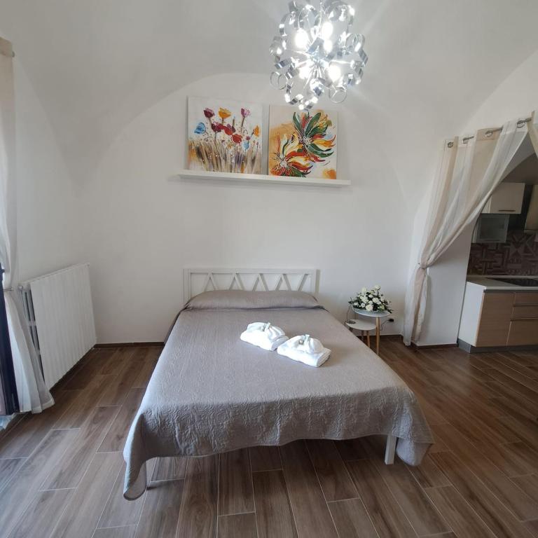 Postel nebo postele na pokoji v ubytování AL BELVEDERE