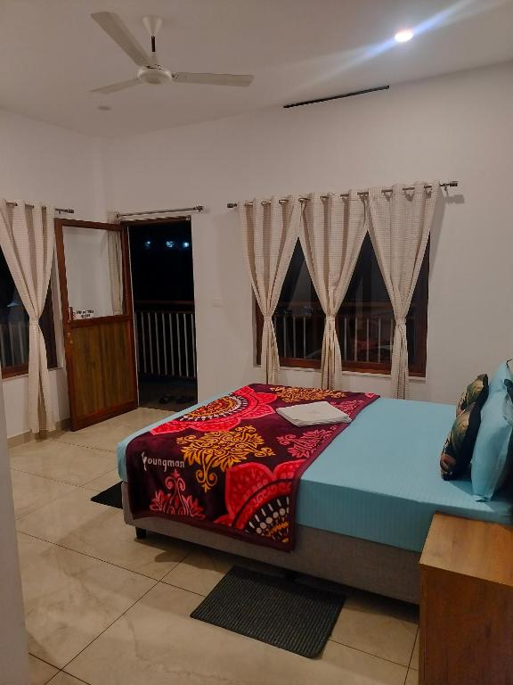 Postel nebo postele na pokoji v ubytování Asprin Homestay