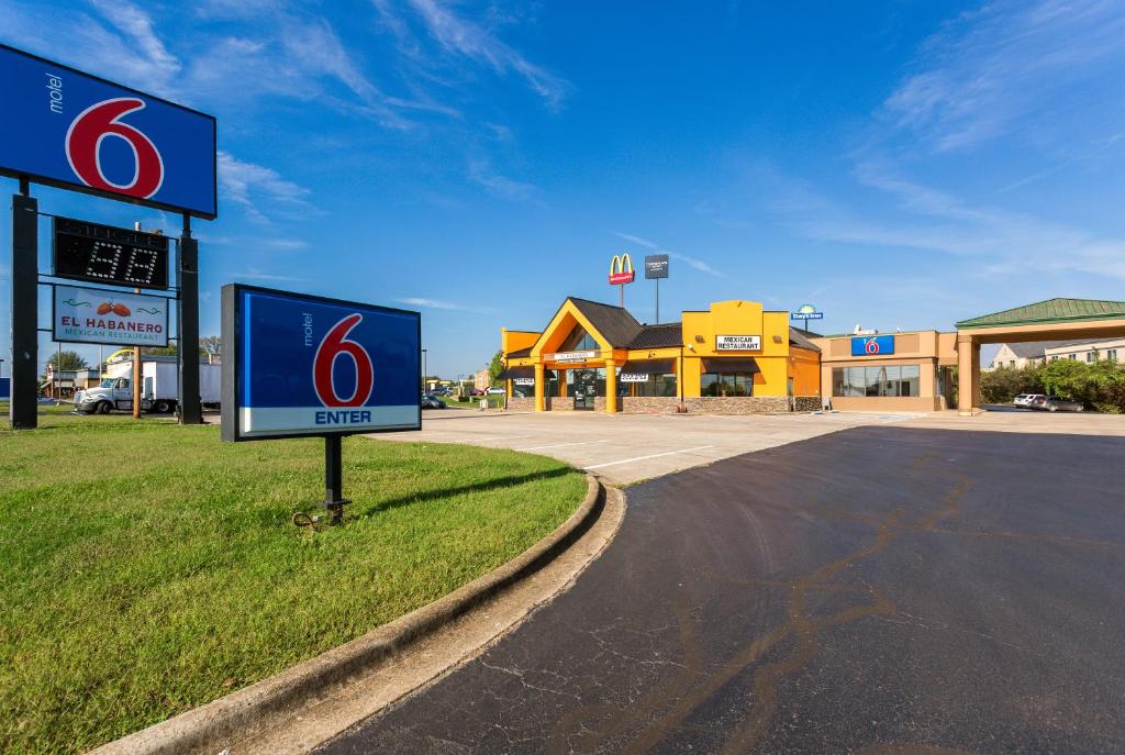 a sign in front of a gas station at Motel 6-Clarksville, TN in Clarksville