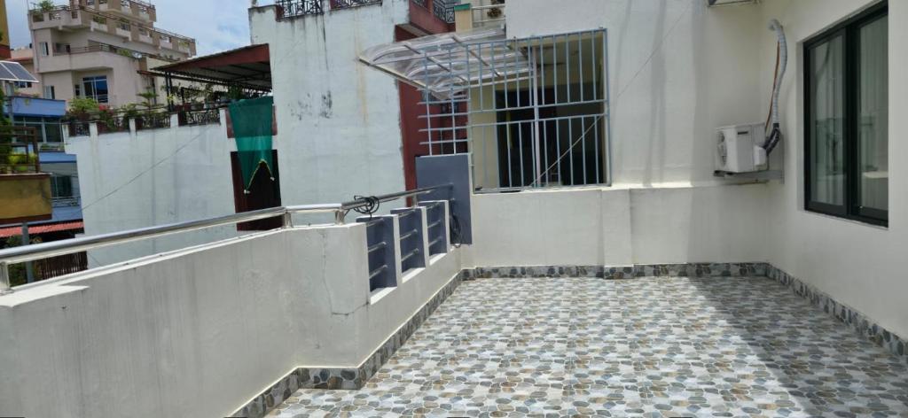 a building with a staircase leading up to a window at ABS peace home in Burhānilkantha