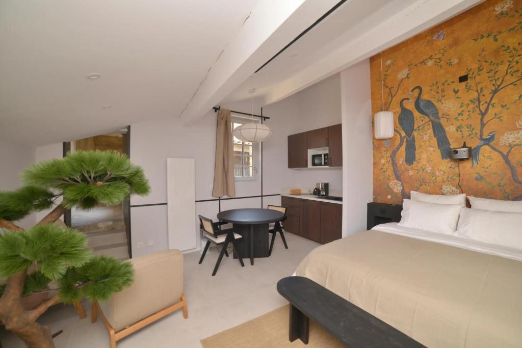 Postel nebo postele na pokoji v ubytování Suite Japonaise Pezenas