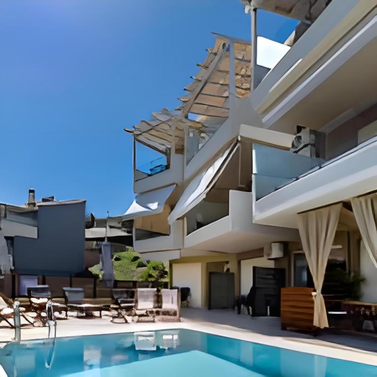 a house with a swimming pool and a staircase at Melodia Lefkada Apartment 3 in Nikiana