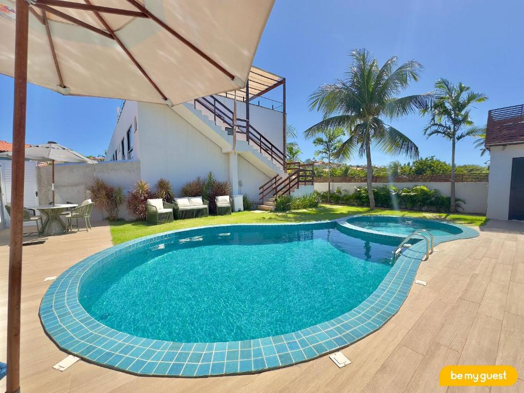 a swimming pool in the backyard of a house at Bella Arte 2 Rooftop in Aquiraz