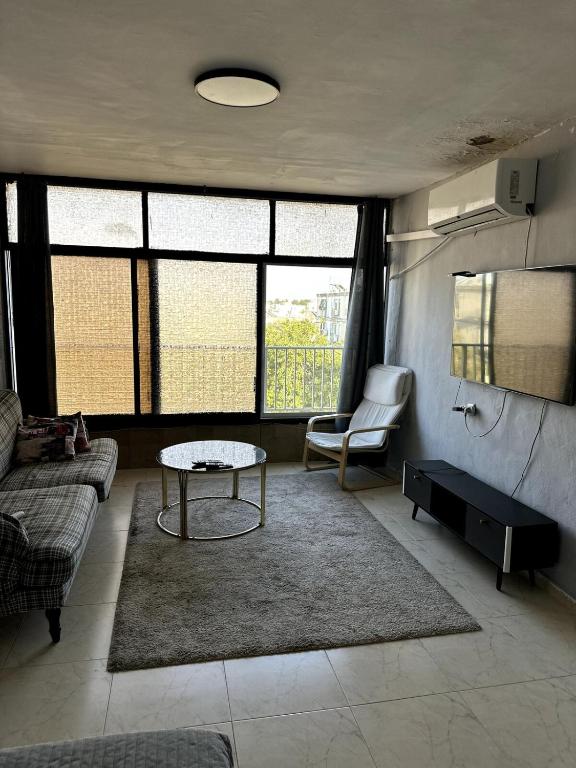 Et opholdsområde på Family apt on the beach