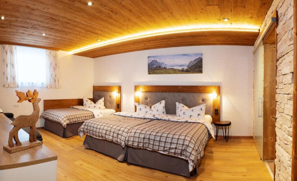 Postel nebo postele na pokoji v ubytování Wildbach Apartments STUBAI - NEW APARTMENTS