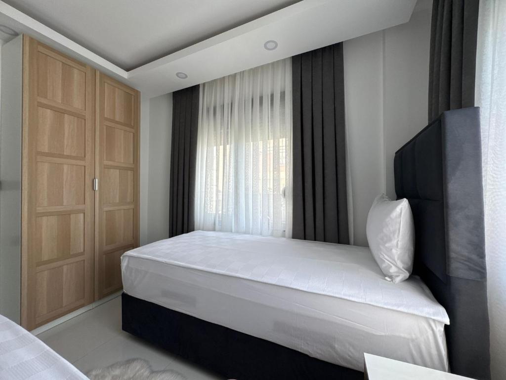 En eller flere senge i et værelse på Sweet Apartment