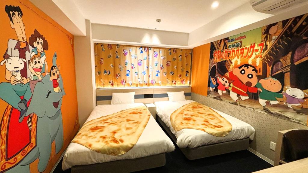 Postel nebo postele na pokoji v ubytování Henn na Hotel Premier Kagoshima Tenmonkan