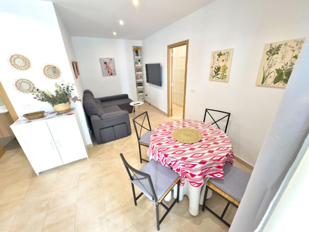 a dining room with a table and chairs in a room at Charming Apartment in the Heart of Old Town in Marbella