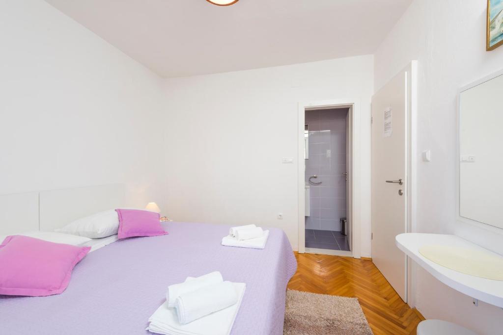 Posteľ alebo postele v izbe v ubytovaní Apartments Nikola Stipišić
