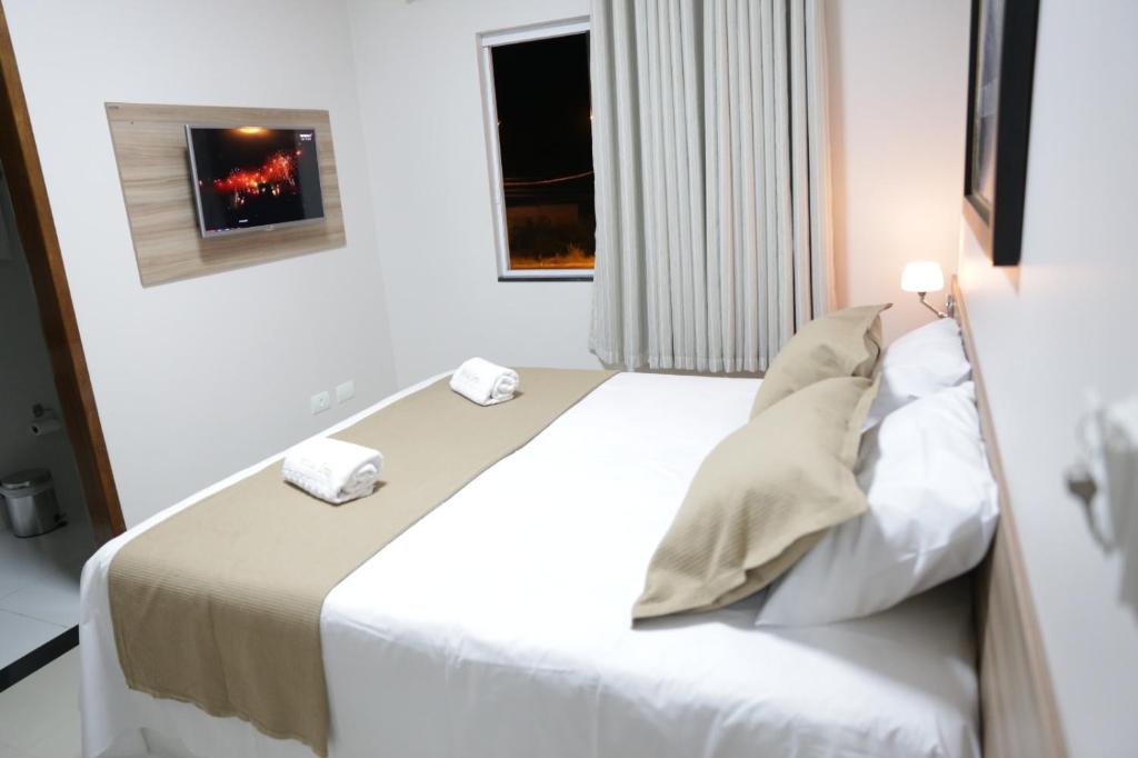 Postel nebo postele na pokoji v ubytování Hotel das Torres