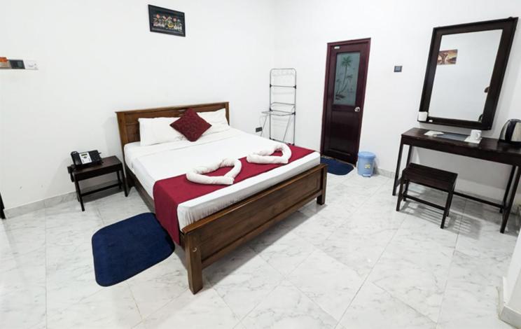 Postel nebo postele na pokoji v ubytování Airport Pearl Garden Transit Hotel